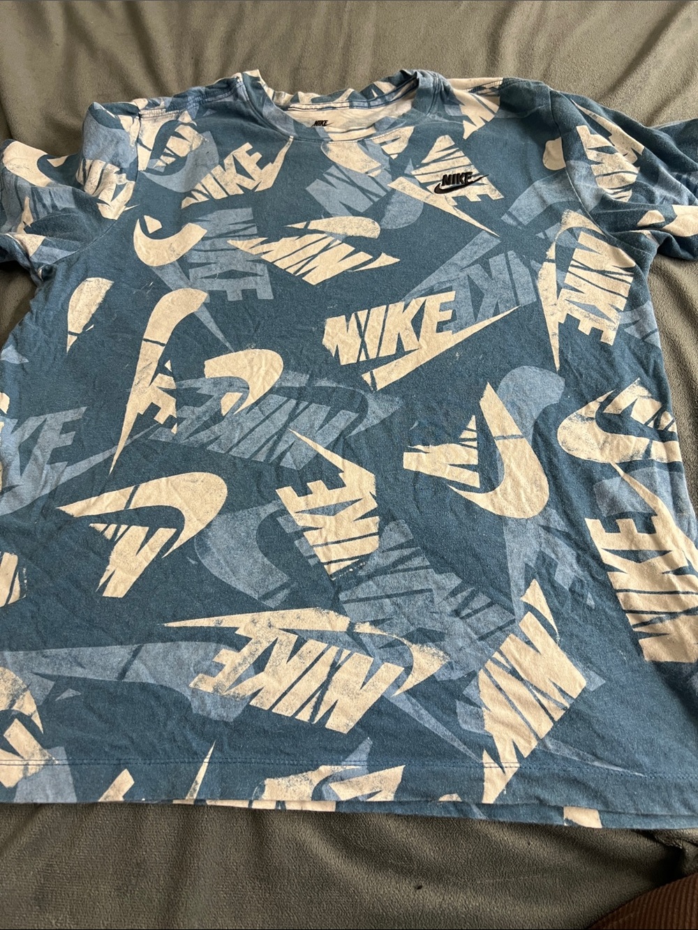 Nike Men’s Blue Tee with Cream Allover Logo Print